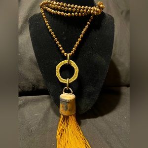 Beaded Necklace with Statement Piece in Center and Tassels